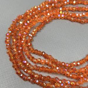 Бусины хрустальные рондель 4х3мм, нить-130 шт, оранжевый прозрачный с АВ