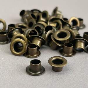 Люверс D-5мм нерж. с пласт. кольцом-антик (100шт) (матр.00254)